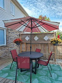 Patio round table, umbrella, 4 chairs, rug