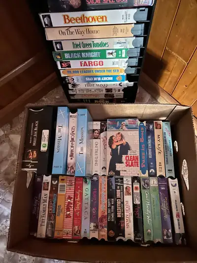 There is a stand to keep your favorites and 65 VHS cassettes including action movies, chick flicks,...