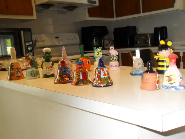 1 LOT OF 14 TRAVEL-SOUVENIR BELLS FROM EXOTIC OVERSEAS DESTINATIONS.