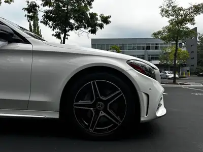 Drive in style with this meticulously maintained white Mercedes-Benz C300 4MATIC, featuring a refine...