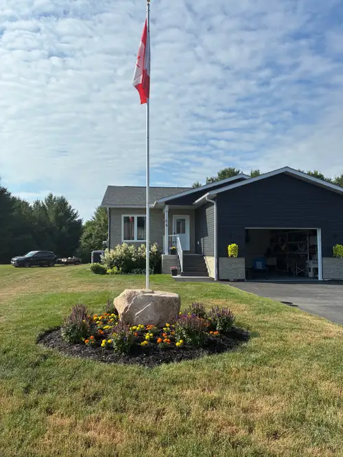 Built in 2022, this 1450 sq. Ft. Bungalow features open concept with large sunroom looking out into...