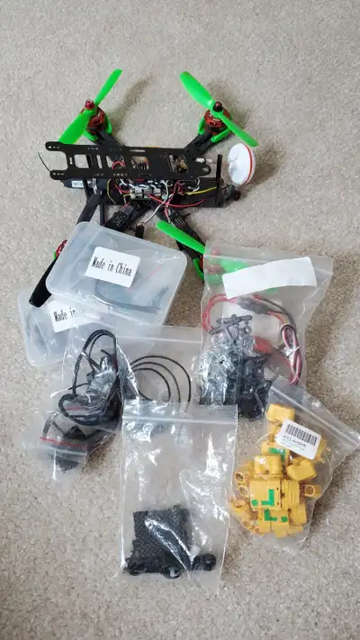 A crashed fpv drone, all parts on drone still function however the reciever has 1 antenna cut off. V...