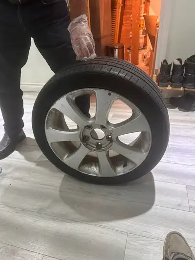 I am selling a set of tires mounted on aluminum alloy rims, designed specifically for a Hyundai Elan...