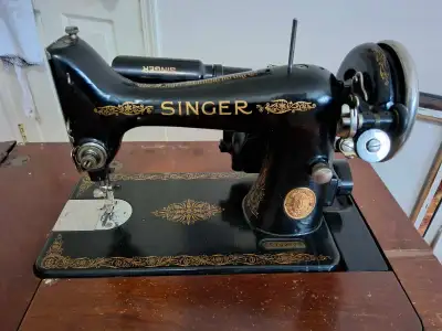 For sale, a vintage Singer Singer sewing machine and original cabinet. I got this as a project but h...