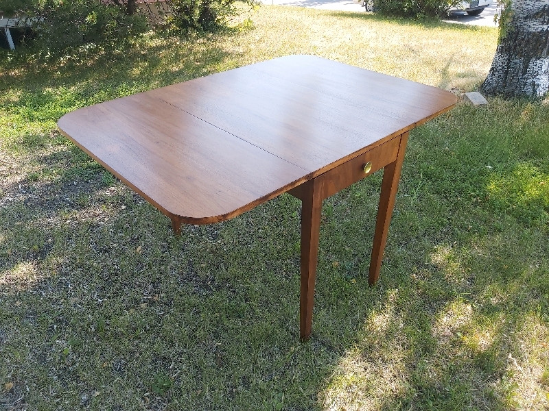 Very cute refinished midcentury table with 2 foldable leaves. Dining Tables & Sets Calgary