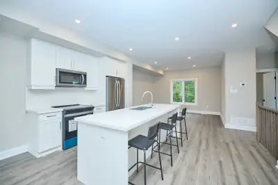 Welcome to this modern 1-year-old end-unit townhouse offering a stylish, functional layout and a pri...