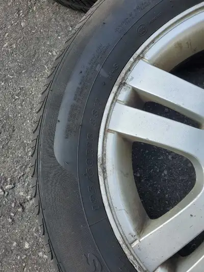195/60 R15 all season tires on aluminum Chevy rims. 4 hole bolt pattern 4 x 114.3mm (4x4.5inches). T...