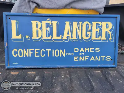 Very cool French tailor sign measuring approximately 33" x 16". Great vibrant colors and nicely self...