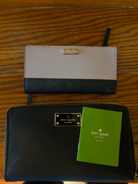 Kate Spade wallets. Pink one has been used, black one is new.
