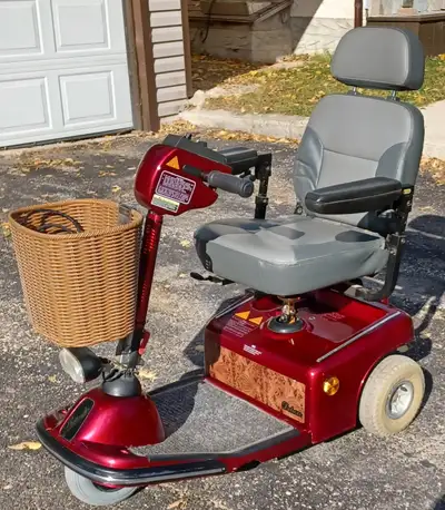 SHOPRIDER , DELUXE ; 300 lbs. cap., 10 km ph., 21 mi. range, 2 12 volt 35 amp batteries (NEW), seat...