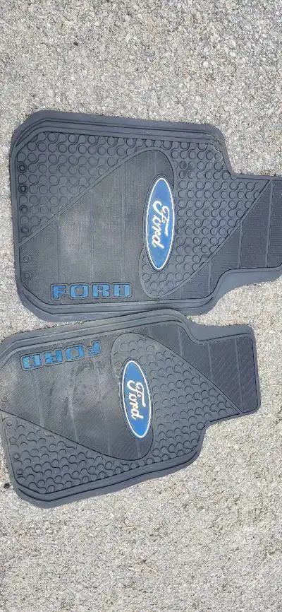 I am offering a collection of new and used car parts, including Ford floor mats in used condition, a...