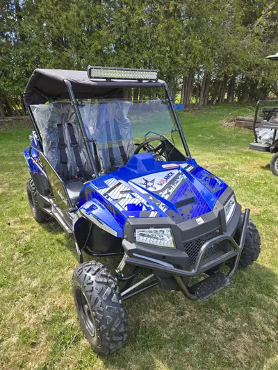 New side by side only 2 miles on it. Road and trail ready. $6500 obo pick up in Listowel Key Specifi...