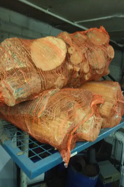 Hardwood firewood bags for sale. Bags are the size of 50 lb. onion bags. Consists of smaller-sized e...