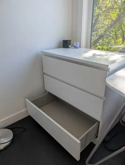 Organize your space with this sleek IKEA Malm 3-drawer dresser in classic white, featuring smooth-ru...