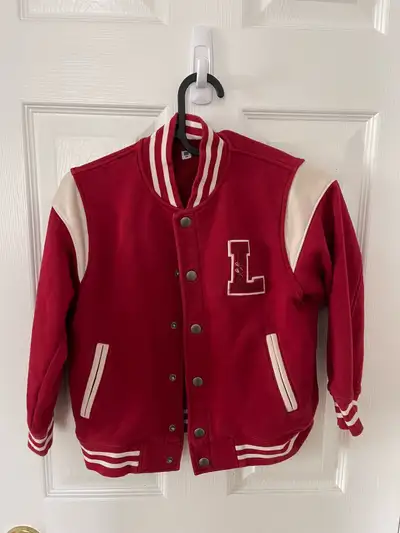 This is a gently used Uniqlo letterman jacket, perfect for keeping your little one warm and stylish!...