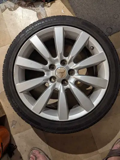Set of 4 Mitsubishi rims with tires used for two seasons
