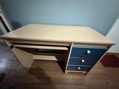Wood desk with blue drawers and keyboard tray, View more