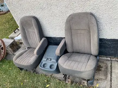 1990's Ford buckets with console. No damage , rips or burns. $280 may trade for an old metal gas sta...