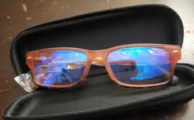 These are new reading glasses with +2.50 magnification, still in their case and original packaging....