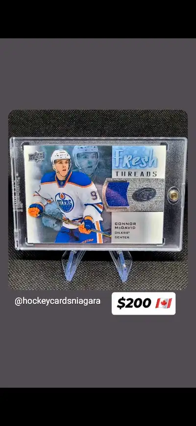 Selling a Connor McDavid Upper Deck Fresh Threads hockey card. This card features a piece of McDavid...