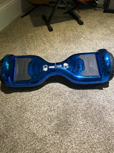 Cruise in style with this sleek blue hoverboard! Gently used and in excellent working condition, thi...