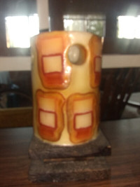 Large Candle on a Wooden Stand