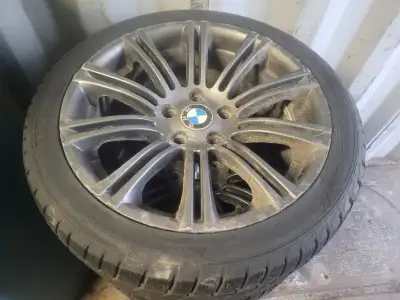 A set of four winter tires and rims. 225 45 18 Sarfire RSW Winter Tires on 2018 BMW 320 iX Rims 5 x...