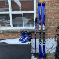 180 Atomic ski with Boots  , poles . Low km 