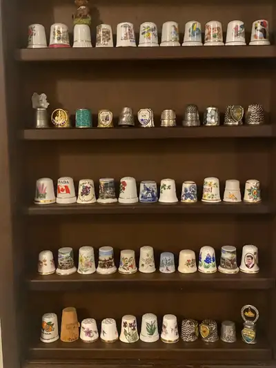 vintage 55 thimbles with wooden rack., View more