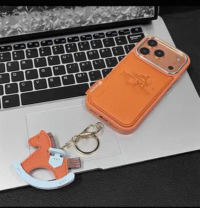 Stylish iphone case with horse-style keychain available, serious buyer only. Chat me up for clearer...