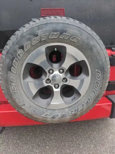 Spare jeep wrangler tire size 55/70 R18 Never been used. In Calgary can deliver or meet up