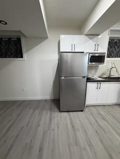 This is a room with a window and a fair amount of light passing through the window to light the room...