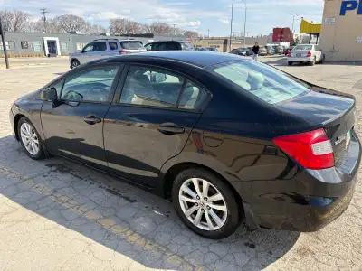This is a used black Honda Civic sedan, offering reliable transportation and good fuel economy. 2380...