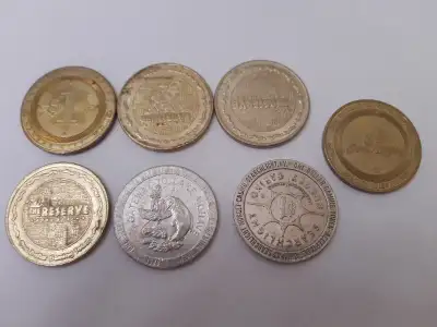 7 old casino gaming tokens, View more