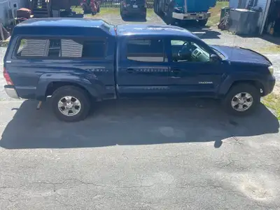 Selling my 2006 Toyota Tacoma Double Cab. It is a four-cylinder, automatic, four-wheel-drive base mo...