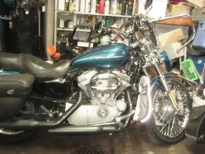 2004 SPORTSTER 883 Custom with only 6964 km. Sapphire blue in like new condition , carbureted .Alway...