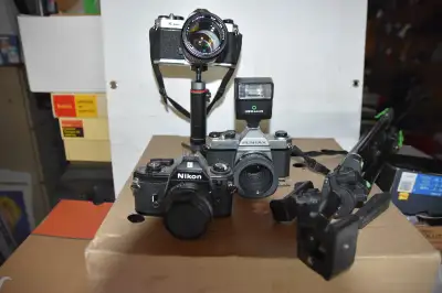 Offering film Cameras and accessories 2 Pentax 1000s and 1 Nikon plus a lightweight tripod Pentax 10...