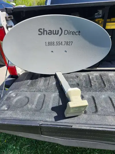 This pre-owned Shaw Direct 60E satellite dish features a dual satellite quad output switchable Ku LN...