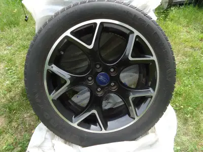4 Excellent condition aluminum rims off a 2013 Focus. Two 215/50r/17 Tiger Paws with tread depth 10/...