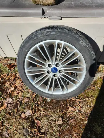 Set of 4 rims and tires off 2018 Ford fusion. 235 45 18 Pirelli AS plus 3 tires with apx 8/32 tread...