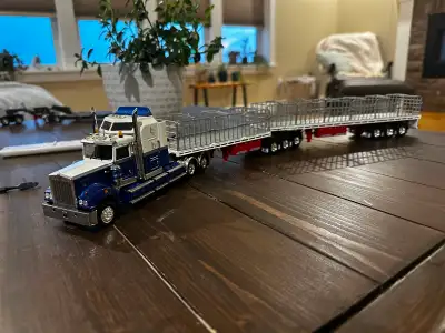 Australian T900 Legend Model. Model comes with a set of 1:50 B-Double flat top trailers with gates....