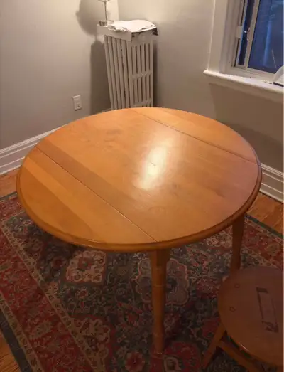 Round dining table with collapsing sides. Perfect for putting next to a window. Width with the sides...