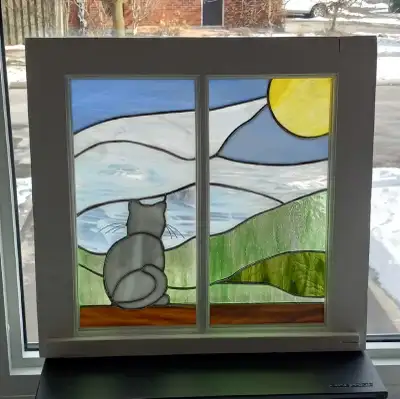 Stained glass scene with cat, View more