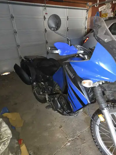 23000 km. Upgraded windshield, seat and exhaust. Factory saddlebags.