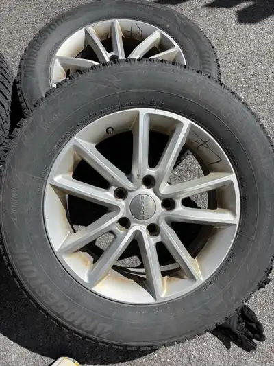 Plenty of thread with rims that came off my dodge grand caravan. 225/65/17
