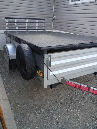 Next to new 2024, 5' by 12' marathon utility trailer, only used once, it is just like new, l have ad...