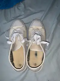 Woman’s white running shoes
