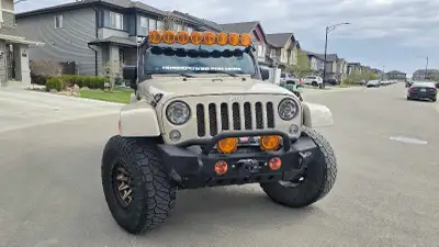Sand Brown Rhino 2016 Jeep Wrangler Rubicon 4X4. Has Sway bar disconnect. Comes with soft and hard t...