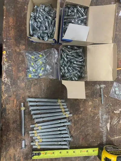 Lot of 15 five inch concrete anchors and three plus boxes of drywall anchors. All for $25 Please not...