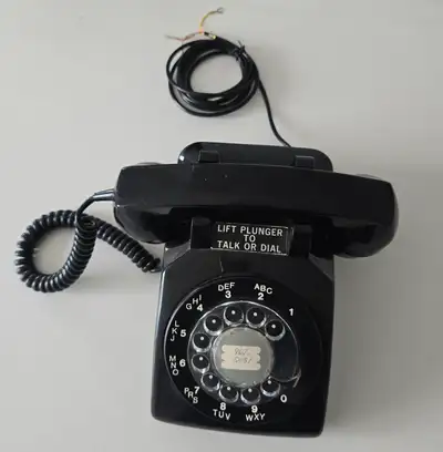 Antique rotary dial phone, View more